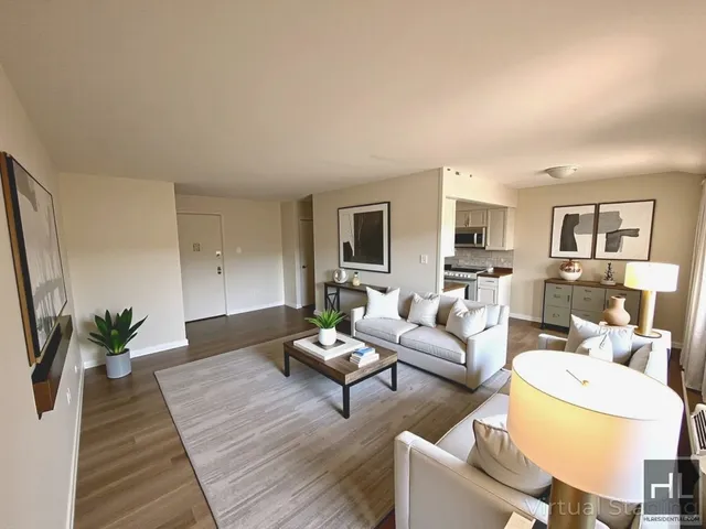 a living room with furniture or couch and a dining table