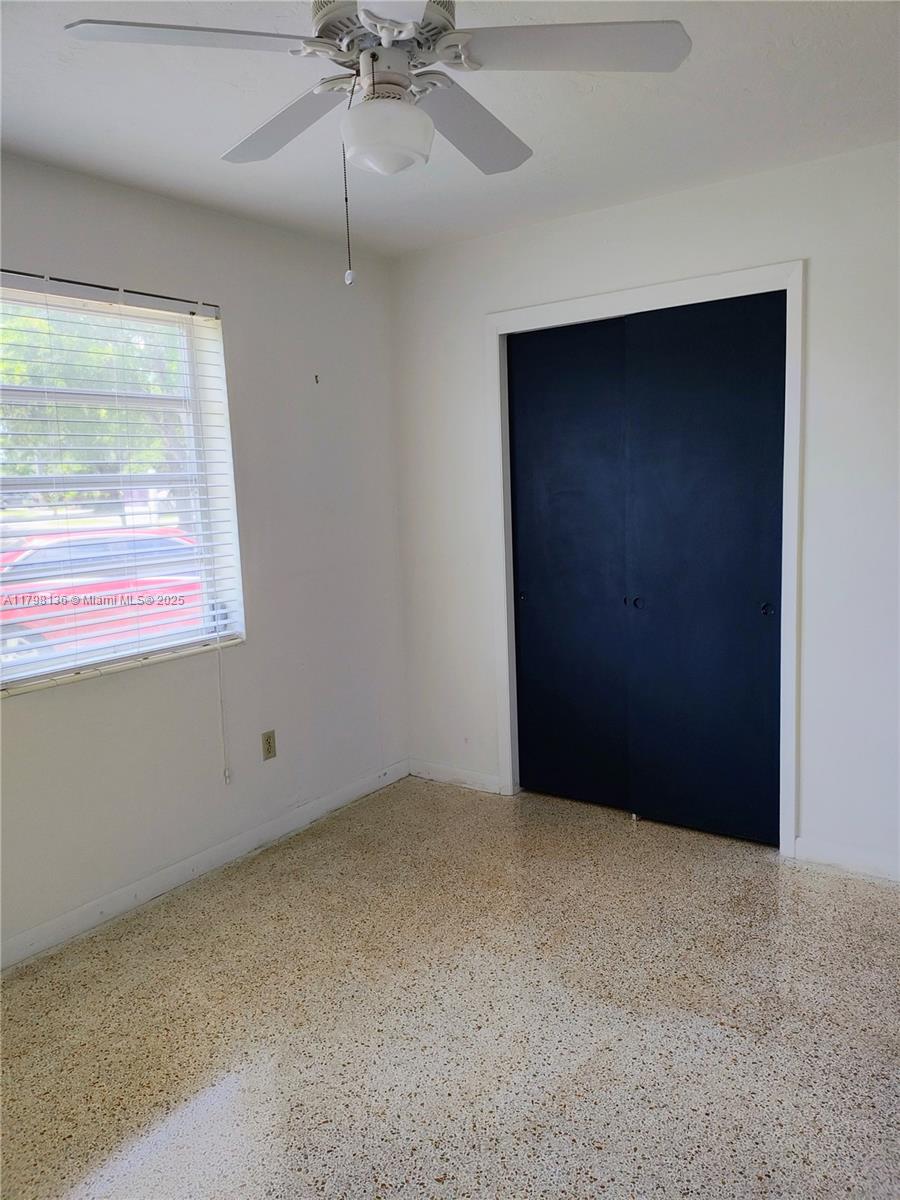 Kendall Miami, FL 33176 - Photo 12 of 28 an empty room with a fan & windows