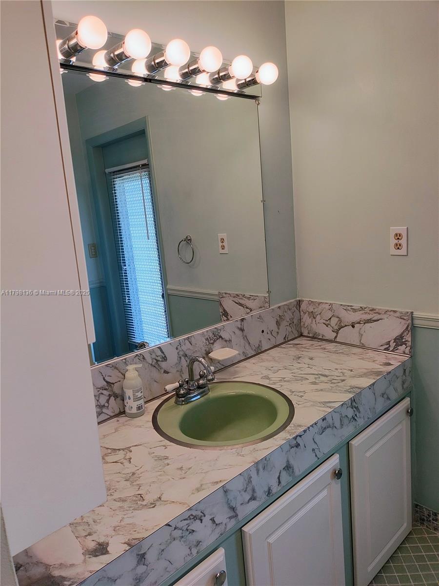 Kendall Miami, FL 33176 - Photo 17 of 28 a bathroom with a sink and a mirror