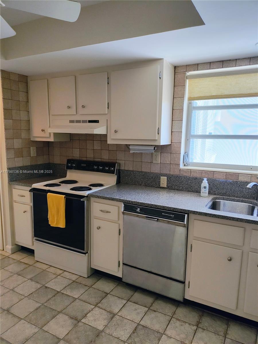 Kendall Miami, FL 33176 - Photo 21 of 28 a kitchen with cabinets appliances and a sink