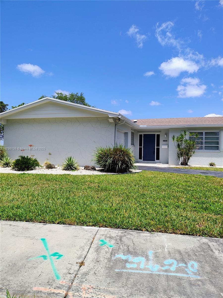 Kendall Miami, FL 33176 - Photo 5 of 28 a front view of a house with a yard and potted plants