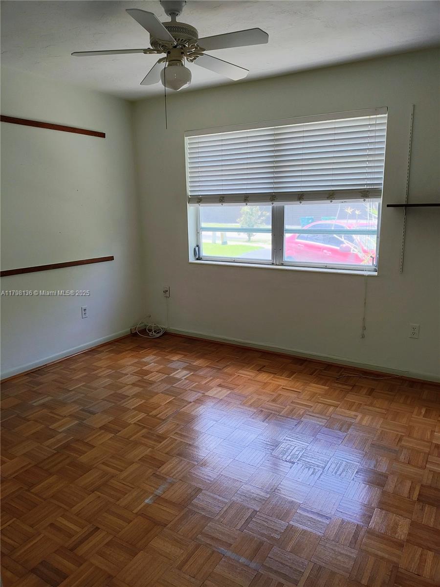 Kendall Miami, FL 33176 - Photo 8 of 28 an empty room with windows and fan