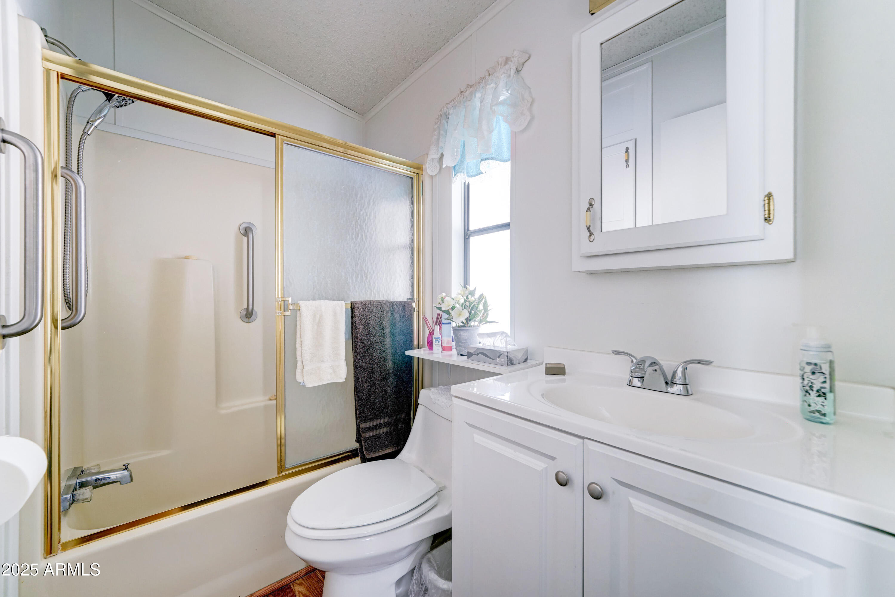 111 South Greenfield Road, Unit 481 Mesa, AZ 85206 - Photo 11 of 22 a bathroom with a sink a toilet and shower