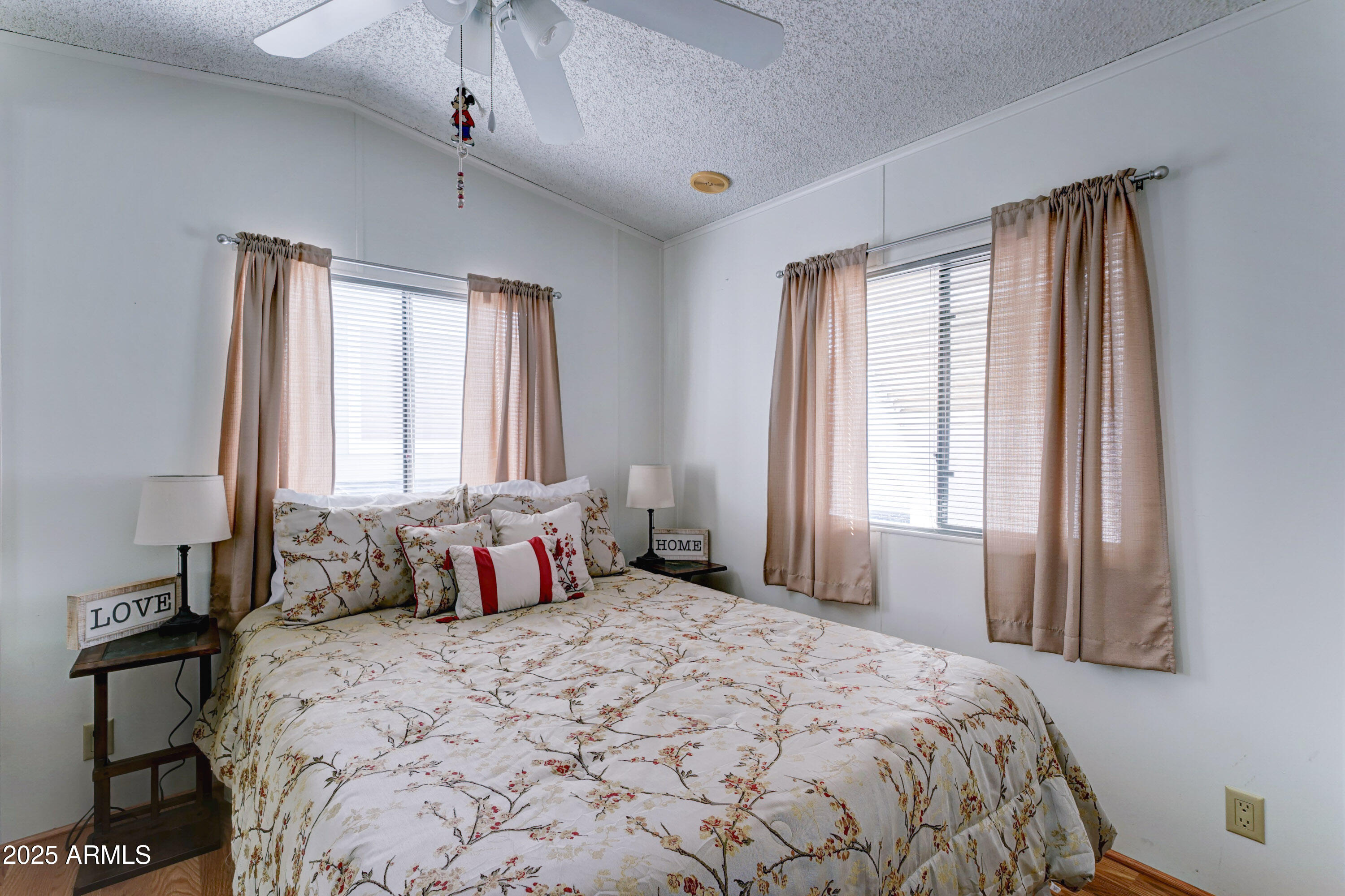 111 South Greenfield Road, Unit 481 Mesa, AZ 85206 - Photo 13 of 22 a bedroom with a large bed and a window