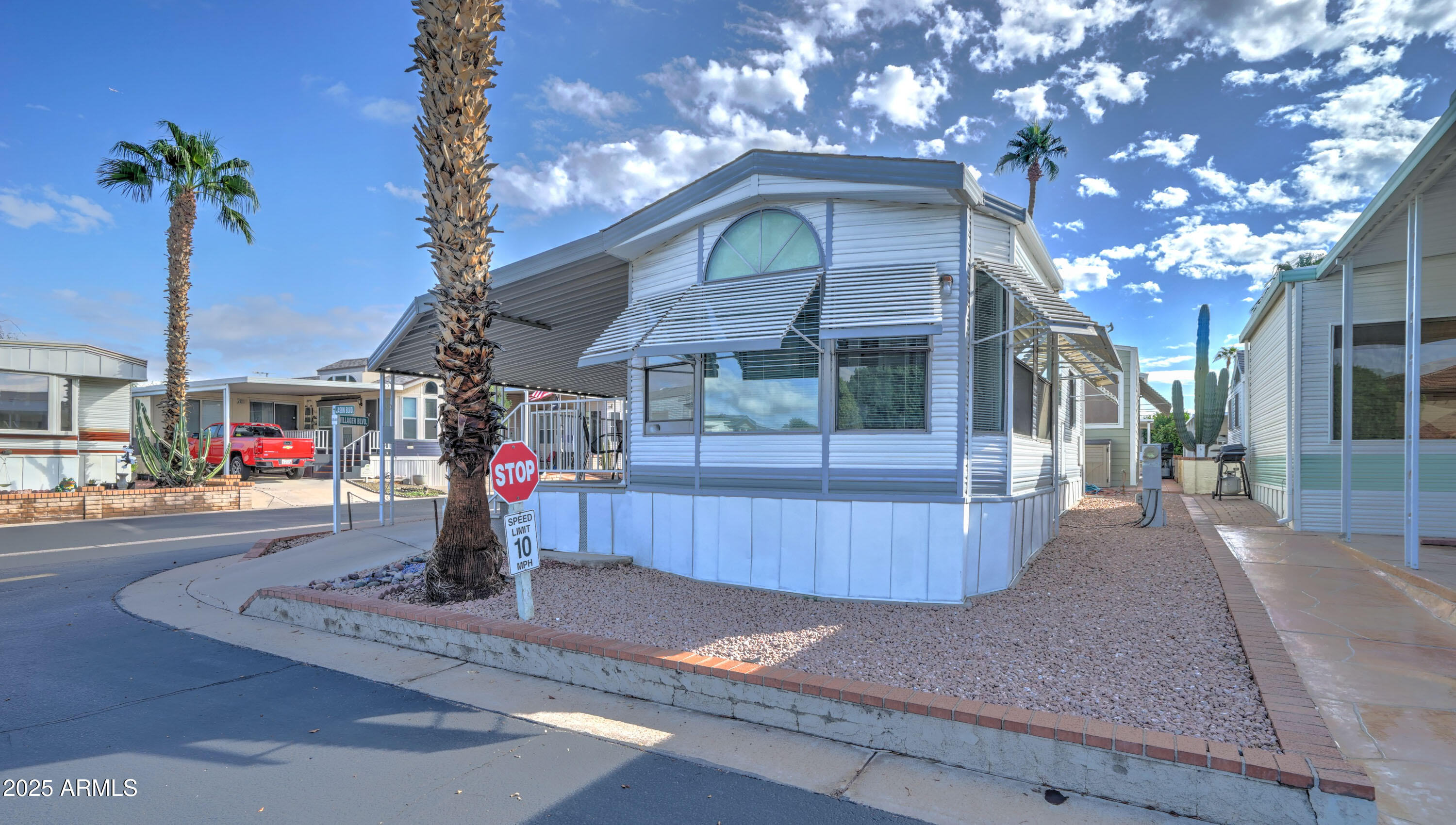 111 South Greenfield Road, Unit 481 Mesa, AZ 85206 - Photo 3 of 22 a front view of a house with street