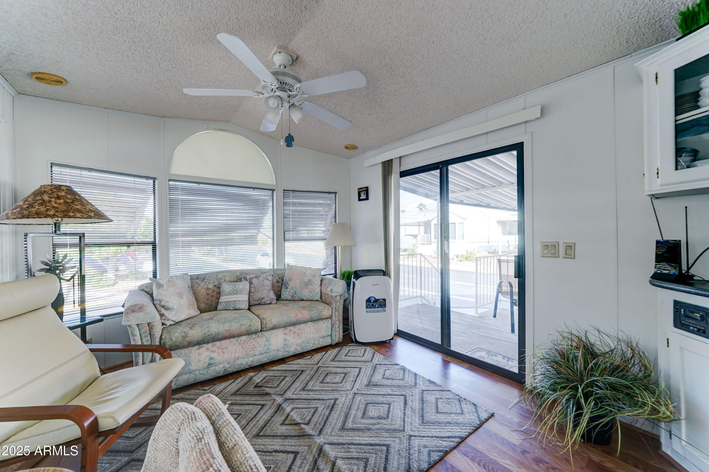 111 South Greenfield Road, Unit 481 Mesa, AZ 85206 - Photo 4 of 22 a living room with furniture and a large window