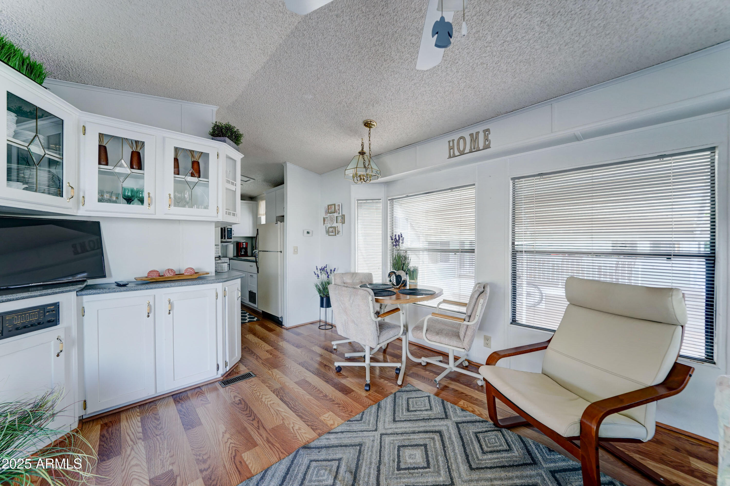 111 South Greenfield Road, Unit 481 Mesa, AZ 85206 - Photo 6 of 22 a living room with furniture and a flat screen tv