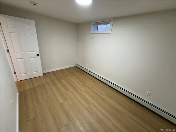 an empty room with wooden floor