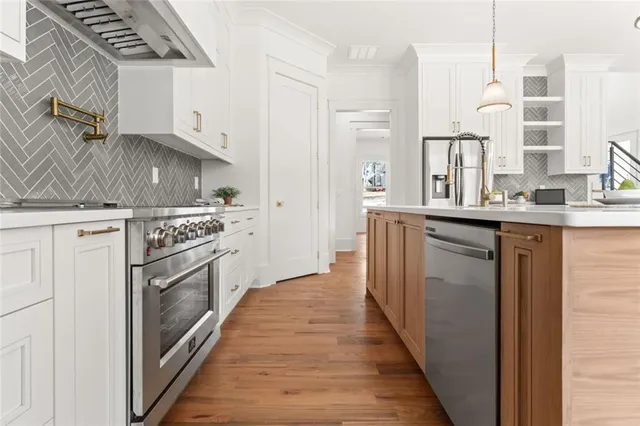 a view of a small space with wooden floor