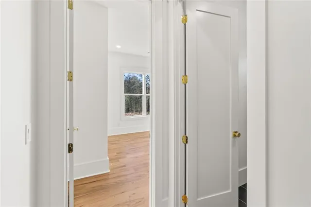 a view of a bedroom and wooden floor