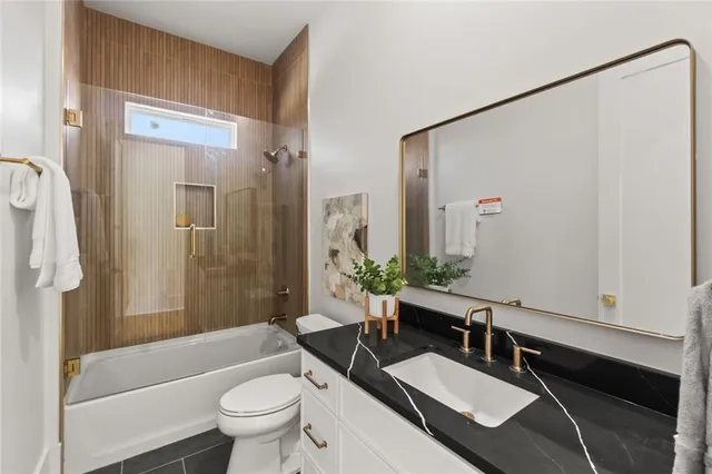 a spacious bathroom with a double vanity sink and a mirror