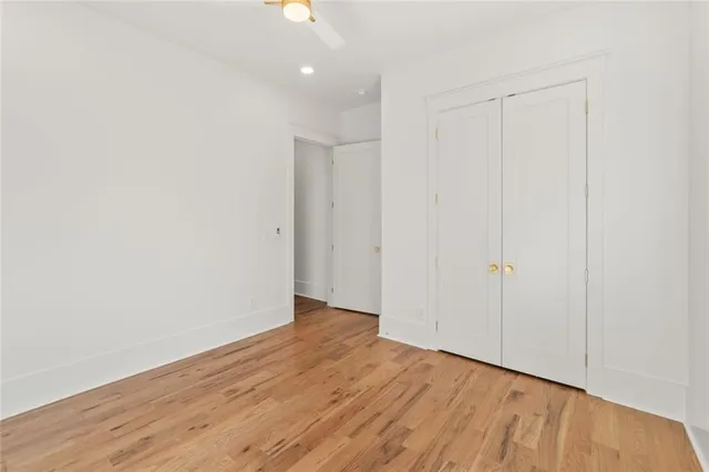 a spacious bathroom with a double vanity sink and a mirror