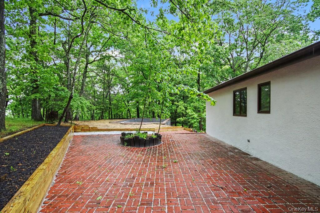18 Hillside View Road Mahopac, NY 10541 - Photo 39 of 42 a backyard of a house with lots of green space