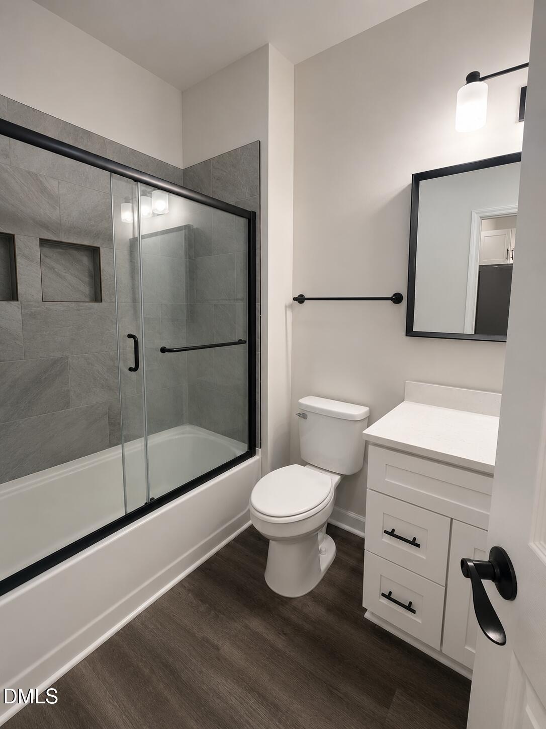 1003 Alma Street, Unit B Durham, NC 27703 - Photo 5 of 5 a bathroom with a toilet a sink and shower