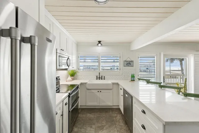 a bathroom with a double vanity sink a mirror and a bathtub