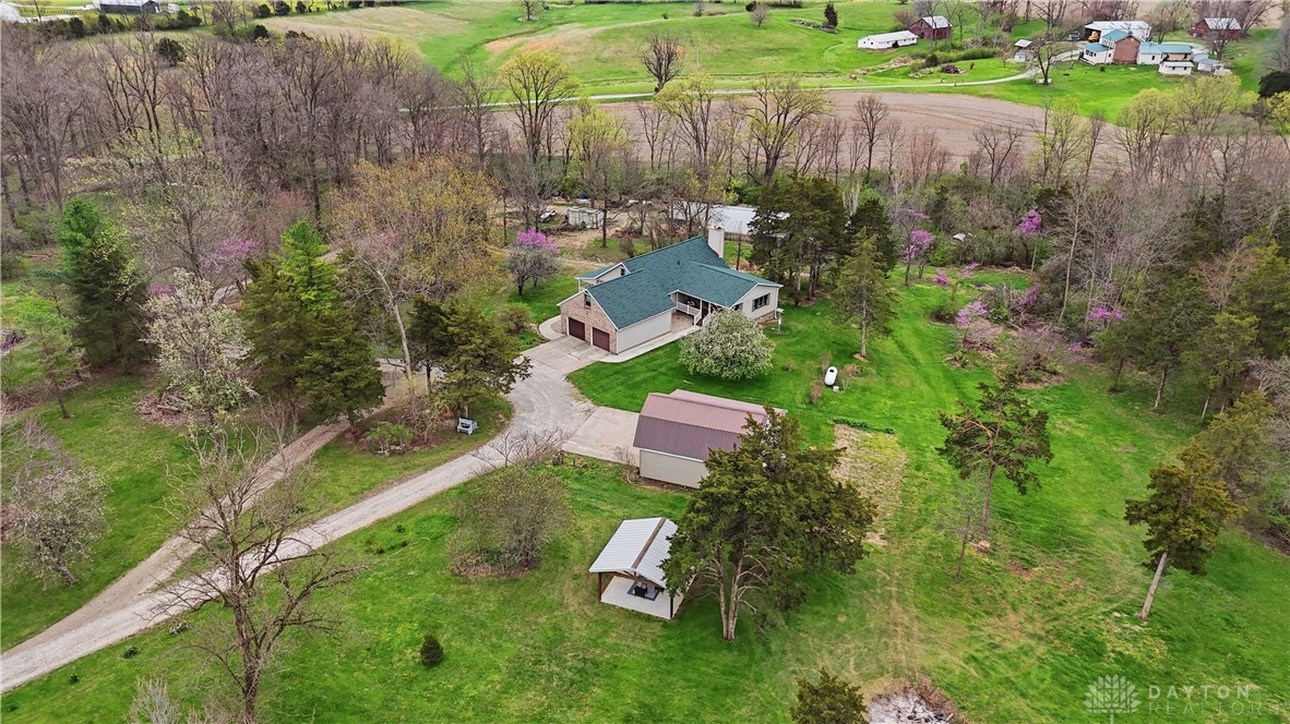 7553 Coffin Station Road Springfield, OH 45502 - Photo 2 of 95 This verdant property offers expansive views and serene rural living.