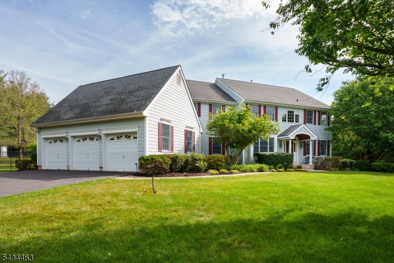 110 Orchard Road Skillman, NJ 08558 - Photo 40 of 43 a front view of a house with a yard and garage