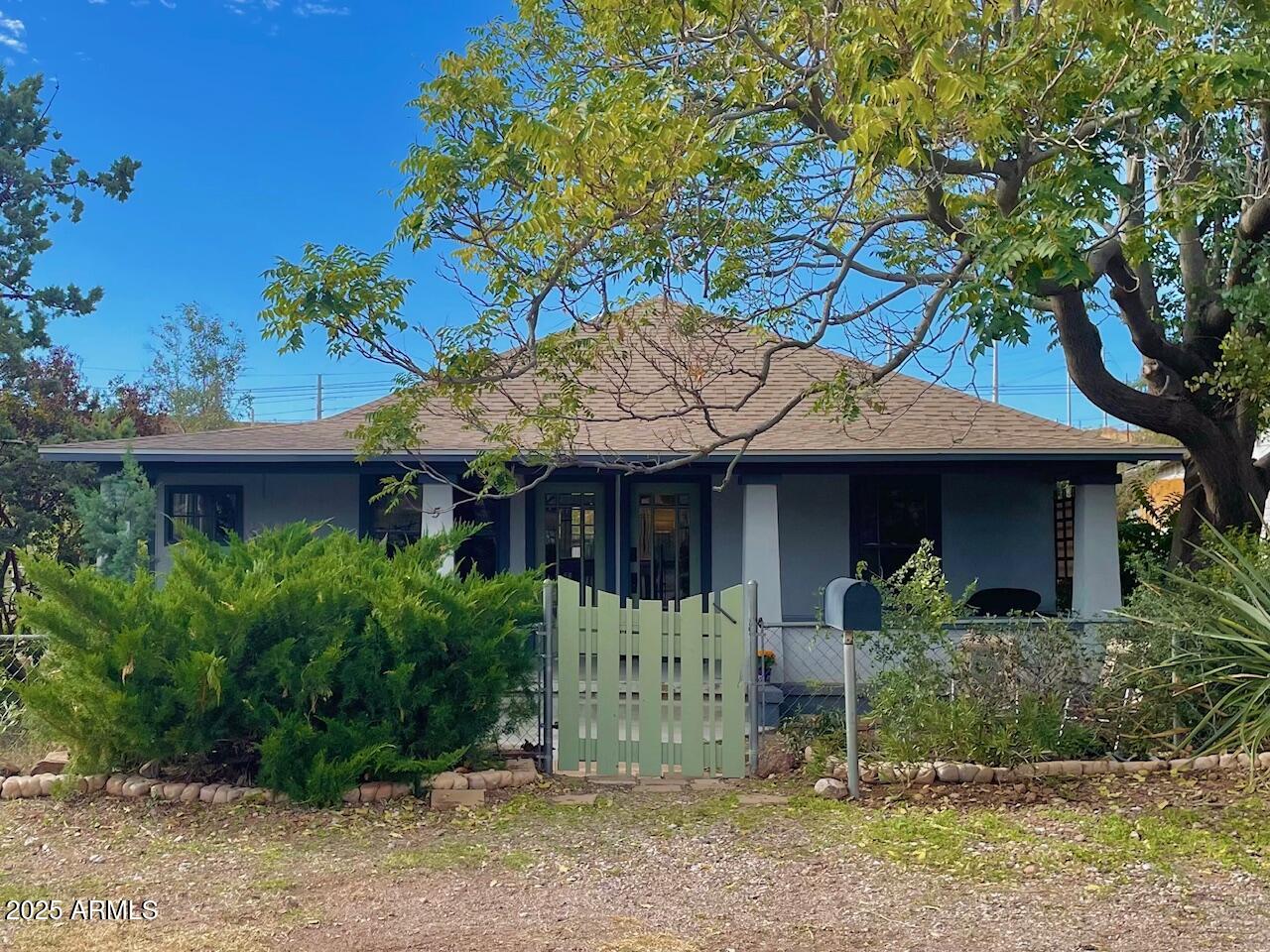 5 Old Douglas Road Bisbee, AZ 85603 - Photo 1 of 35 a front view of a house with garden