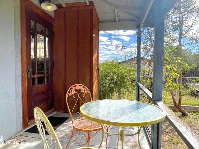 a dining room with furniture window and outside view