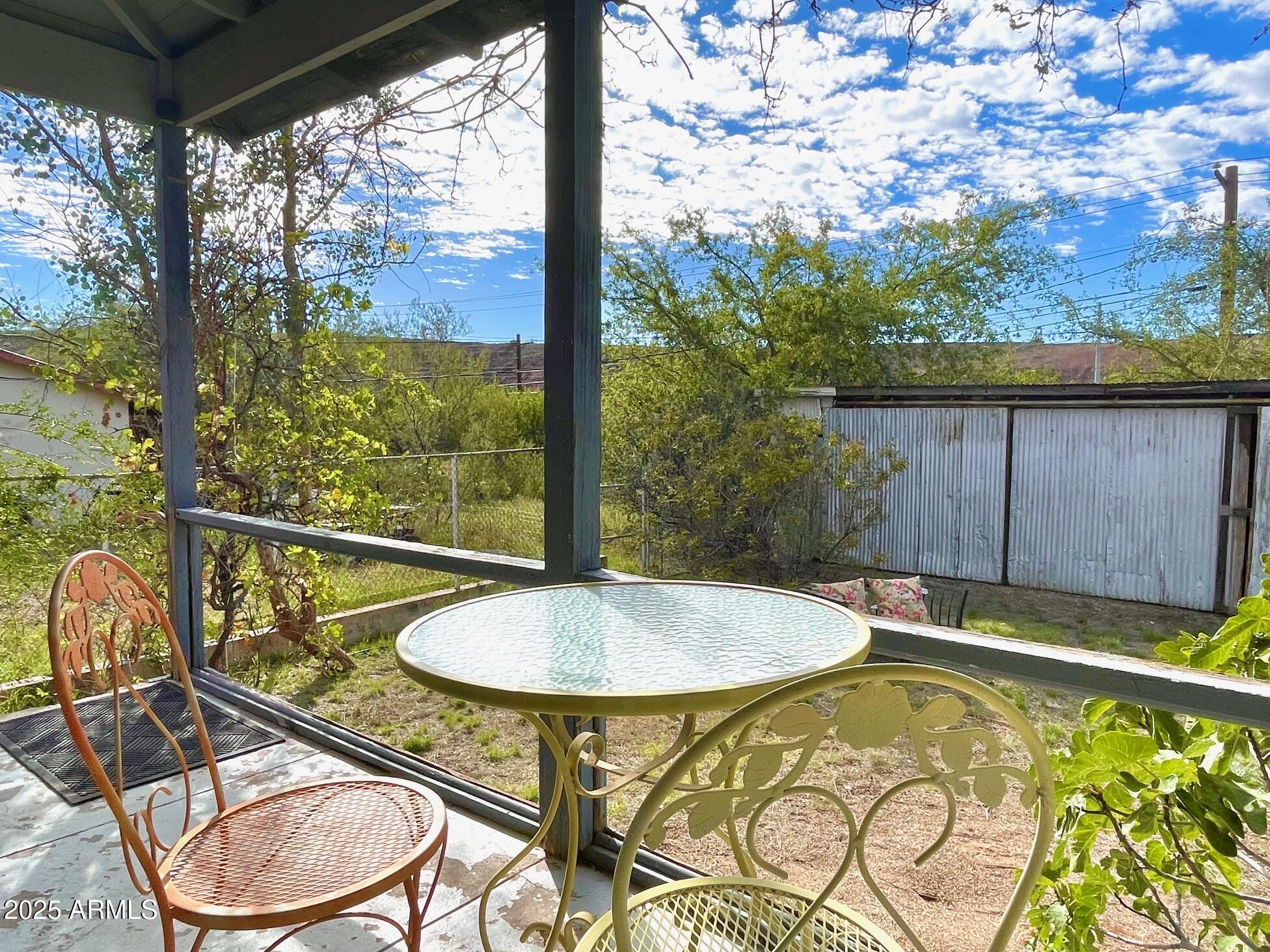 5 Old Douglas Road Bisbee, AZ 85603 - Photo 19 of 35 a view of a swimming pool with a patio and a yard
