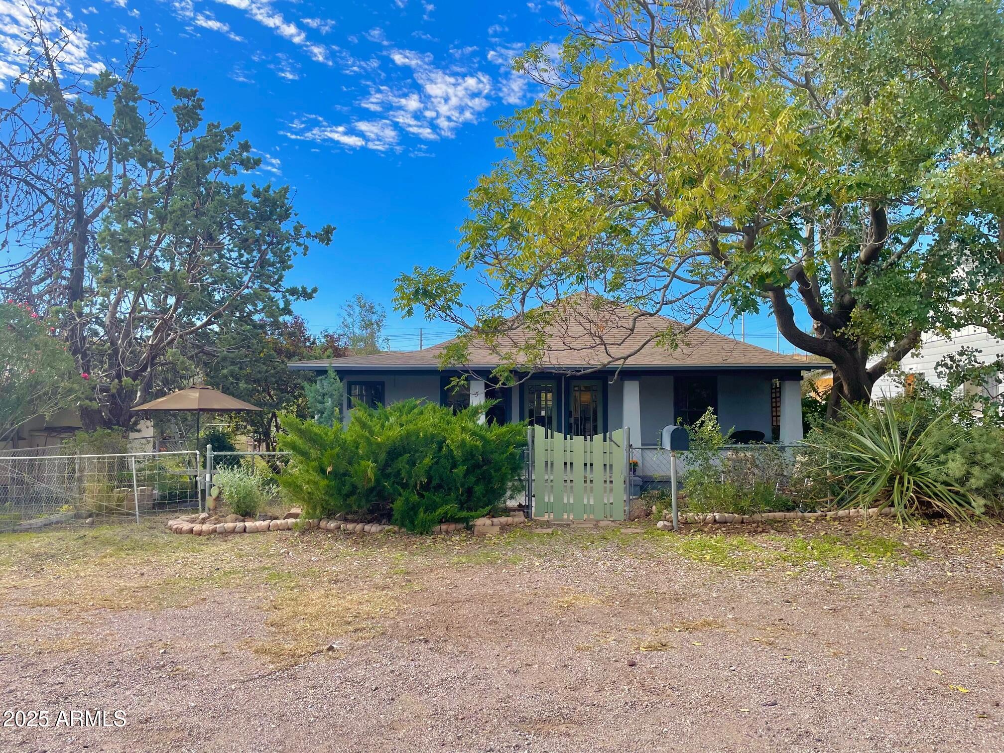 5 Old Douglas Road Bisbee, AZ 85603 - Photo 2 of 35 a front view of a house with a yard