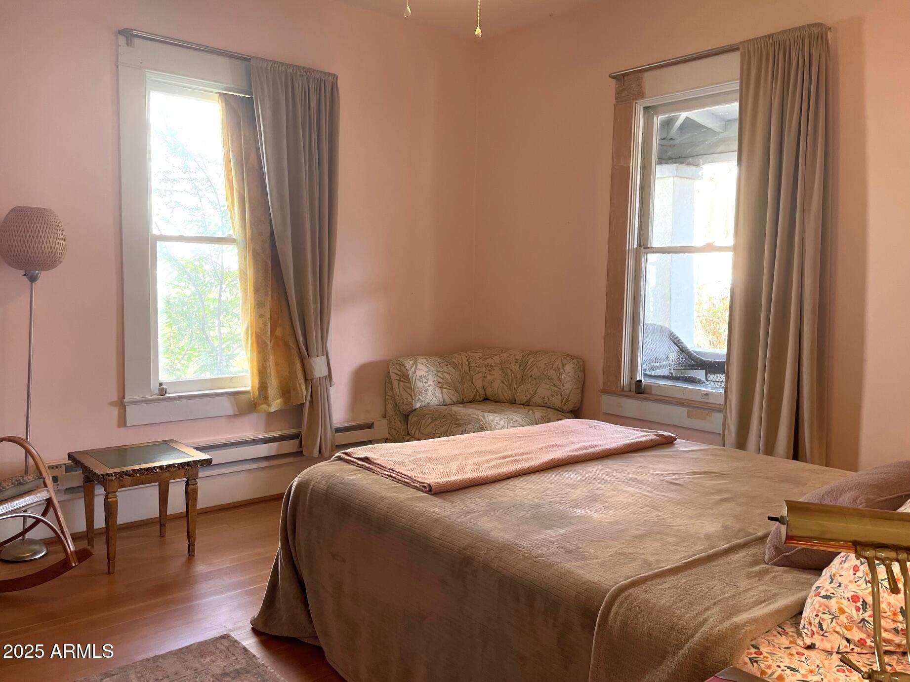 5 Old Douglas Road Bisbee, AZ 85603 - Photo 22 of 35 a bedroom with a bed and a window