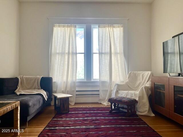 5 Old Douglas Road Bisbee, AZ 85603 - Photo 25 of 35 a bedroom with a bed and wooden floor