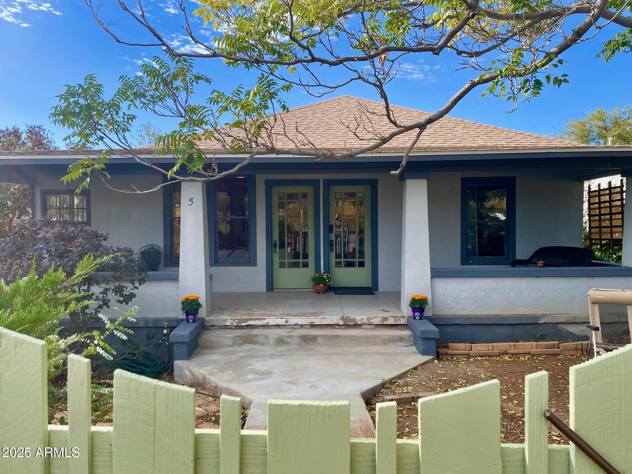 5 Old Douglas Road Bisbee, AZ 85603 - Photo 3 of 35 a view of a house with potted plants