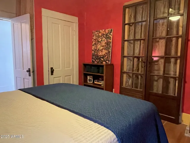 a bedroom with a bed and a window