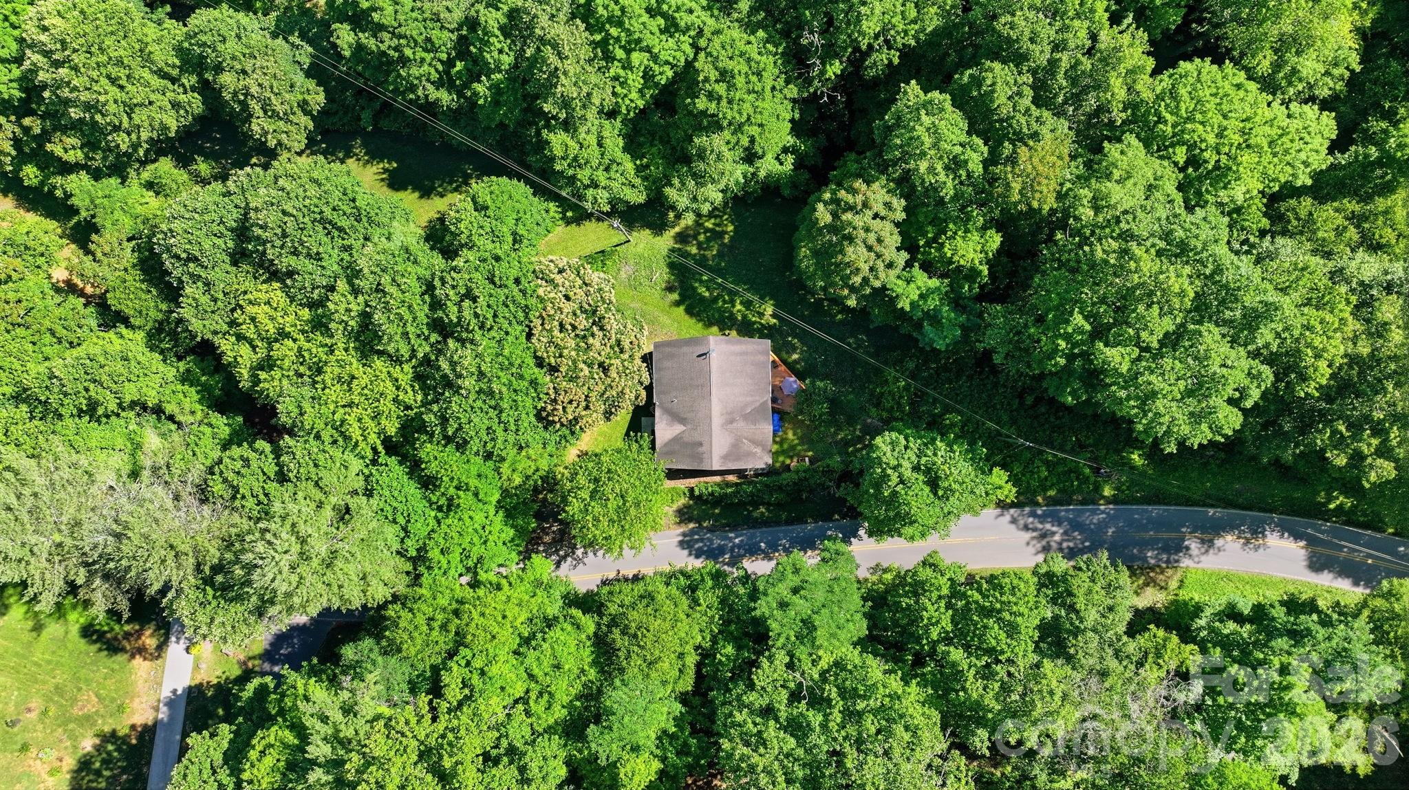 583 Dark Ridge Road Sylva, NC 28779 - Photo 6 of 48 an aerial view of a house with a yard