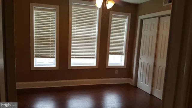 a bathroom with a sink vanity and a mirror