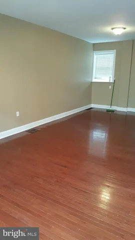 a kitchen with granite countertop a sink stove and refrigerator