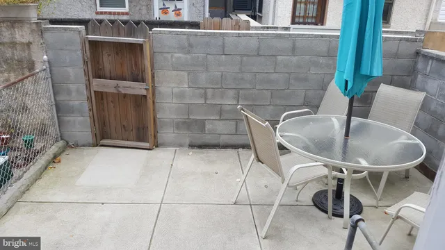 a kitchen with a sink a stove and cabinets
