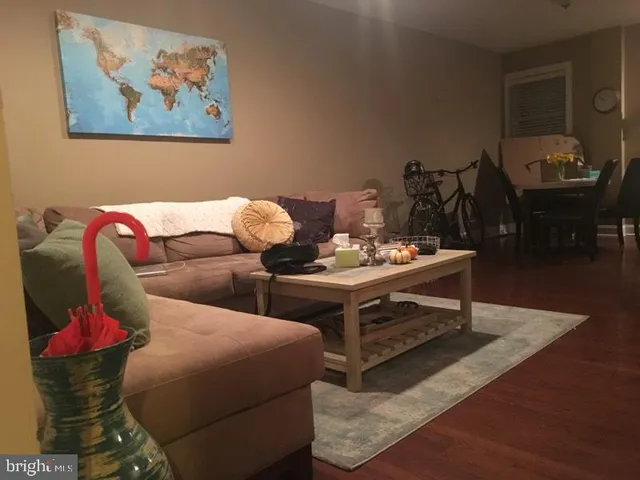 a living room with furniture and next to a window