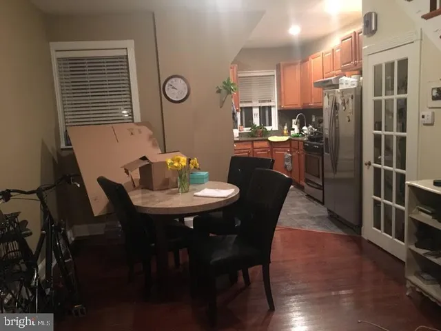 a dining room with furniture and window