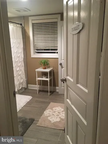 a room with window and chair