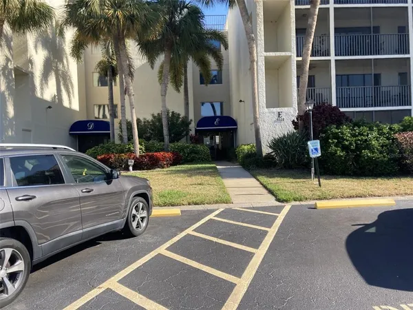 a view of a yard with car parked