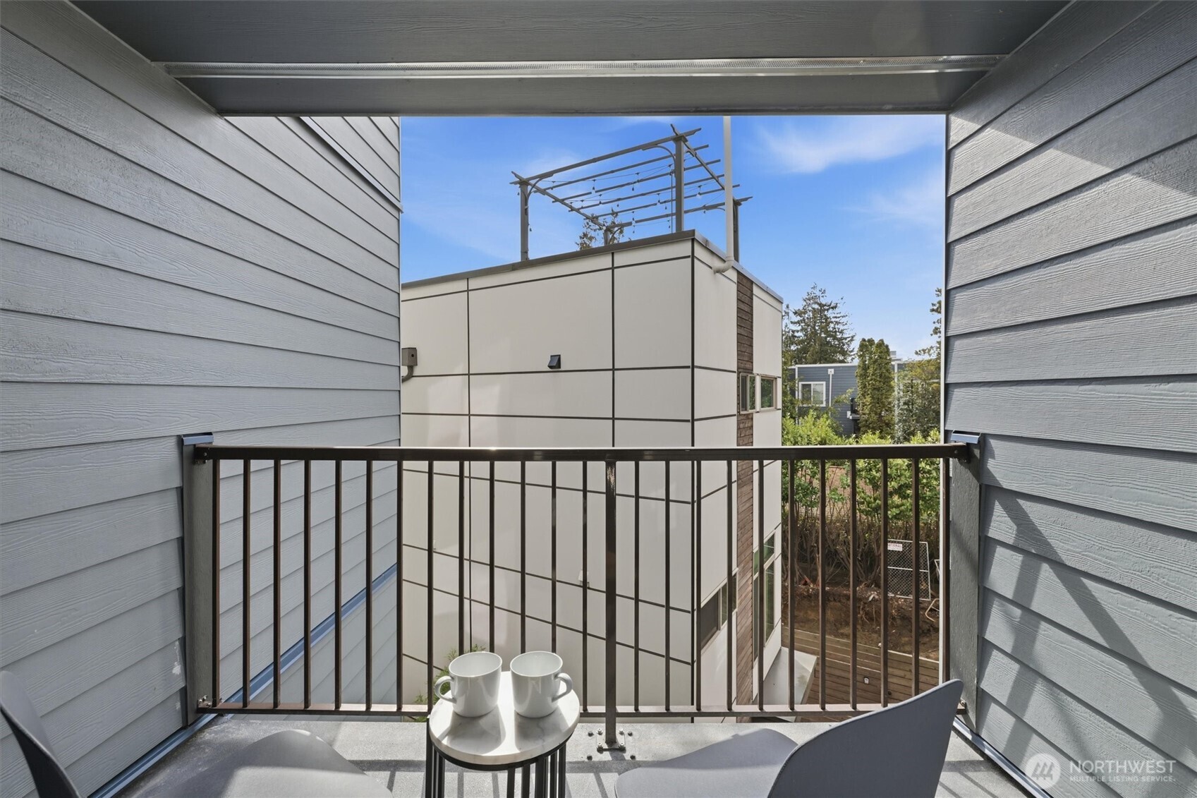 3045 20th Avenue West, Unit 303 Seattle, WA 98199 - Photo 21 of 28 a view of a balcony with wooden floor