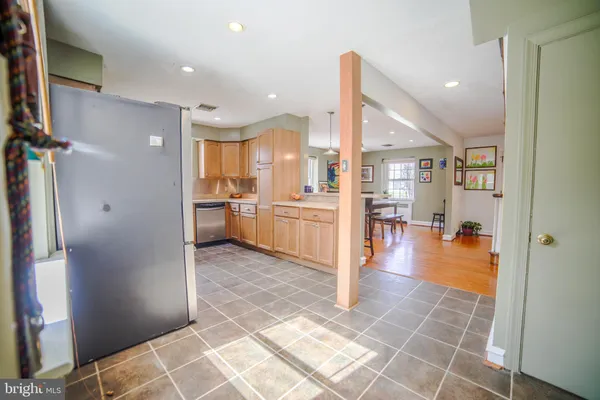 a view of a kitchen from the hallway