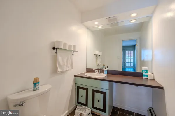 a dining hall with a sink and a mirror