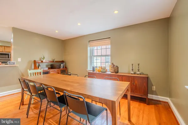 a dining room with a table and chairs