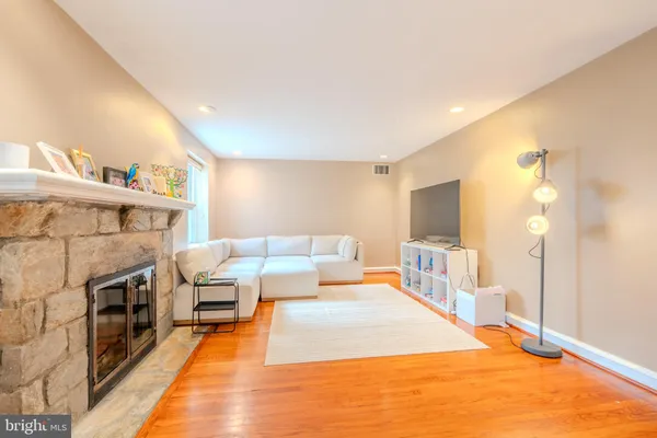 a bedroom with furniture and a fireplace
