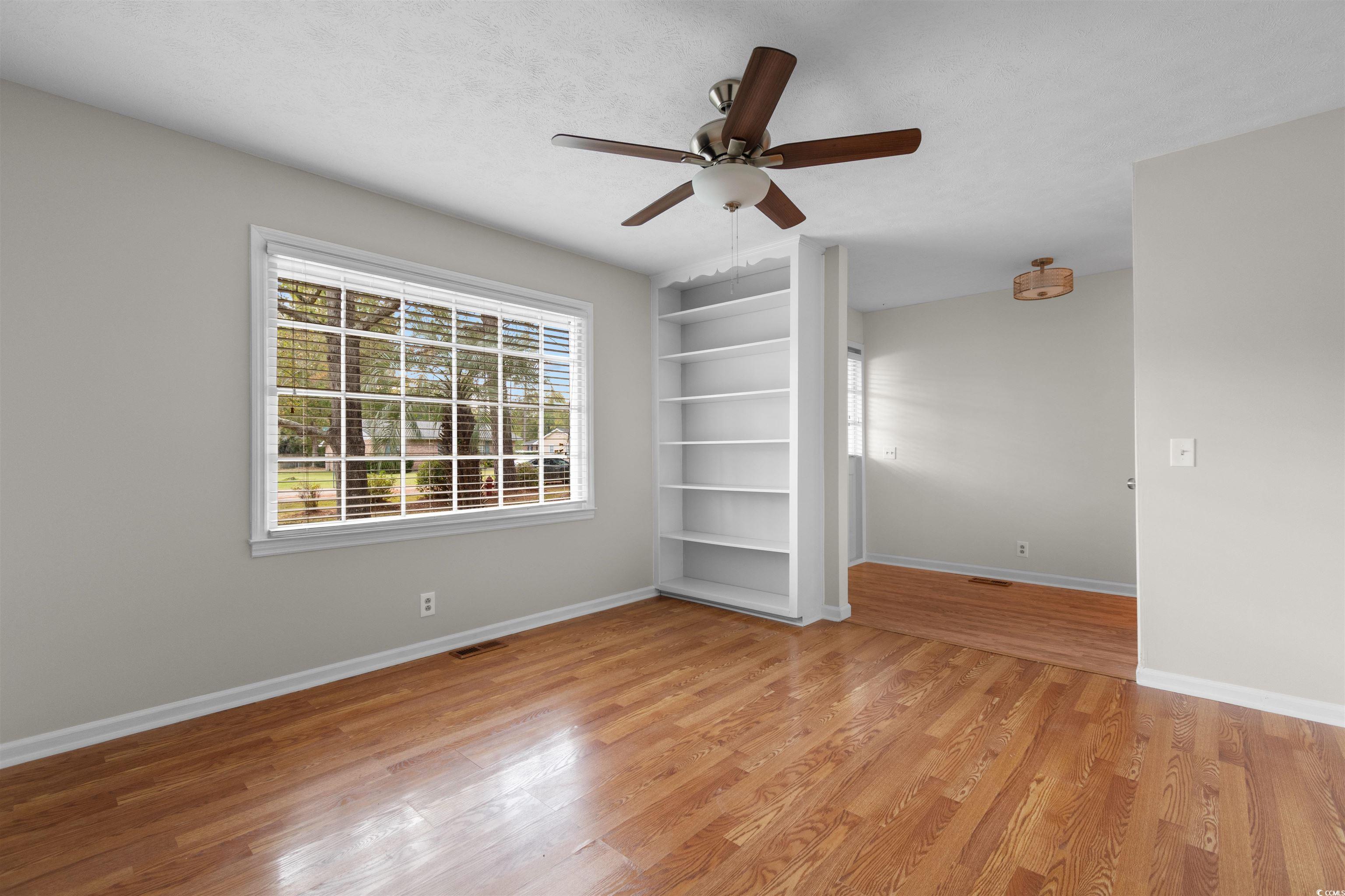 3870 Woodchuck Road Myrtle Beach, SC 29579 - Photo 3 of 32 Spare room with ceiling fan, a textured ceiling, a