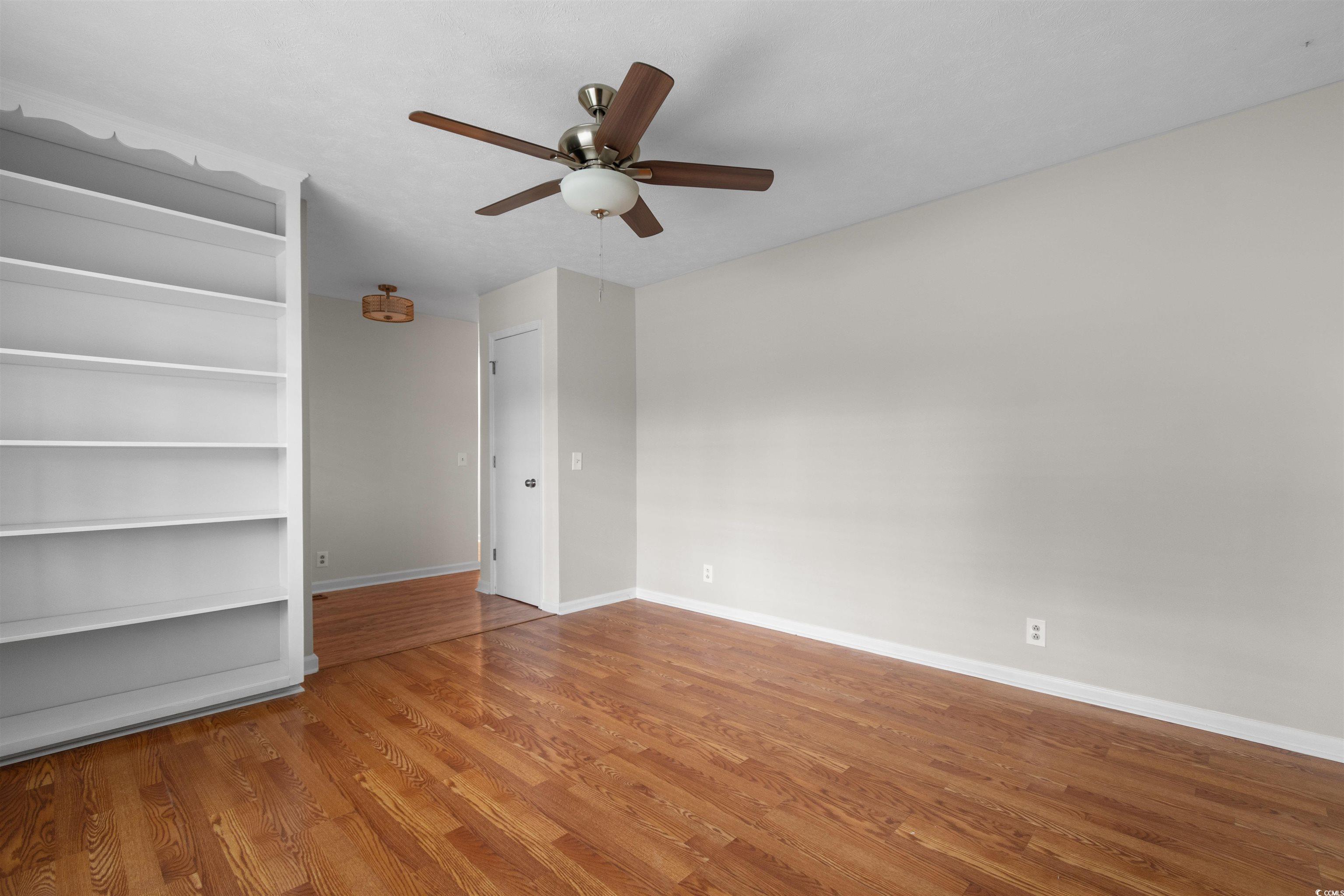 3870 Woodchuck Road Myrtle Beach, SC 29579 - Photo 4 of 32 Spare room with hardwood / wood-style flooring and