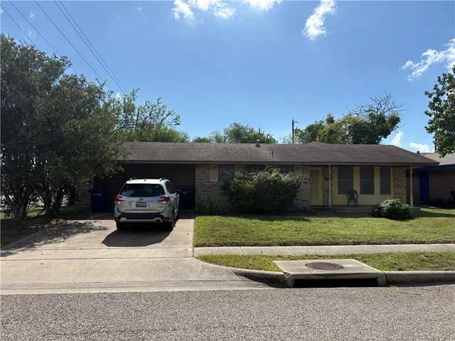 a car parked in front of a house
