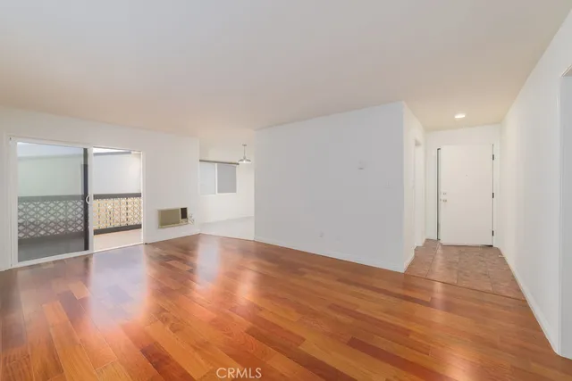 a view of a livingroom with wooden floor