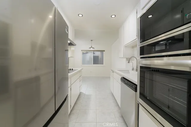 a view of a kitchen from the hallway