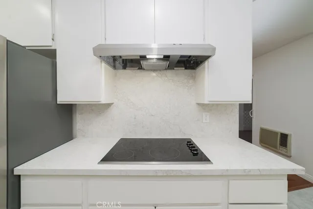 a close view of a stove top oven sitting inside of a kitchen