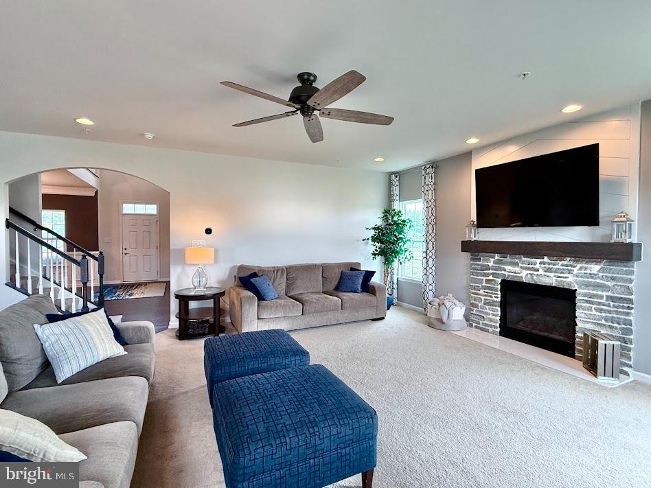 3012 Wasatch View Drive Frederick, MD 21704 - Photo 12 of 54 a living room with furniture a fireplace and a flat screen tv