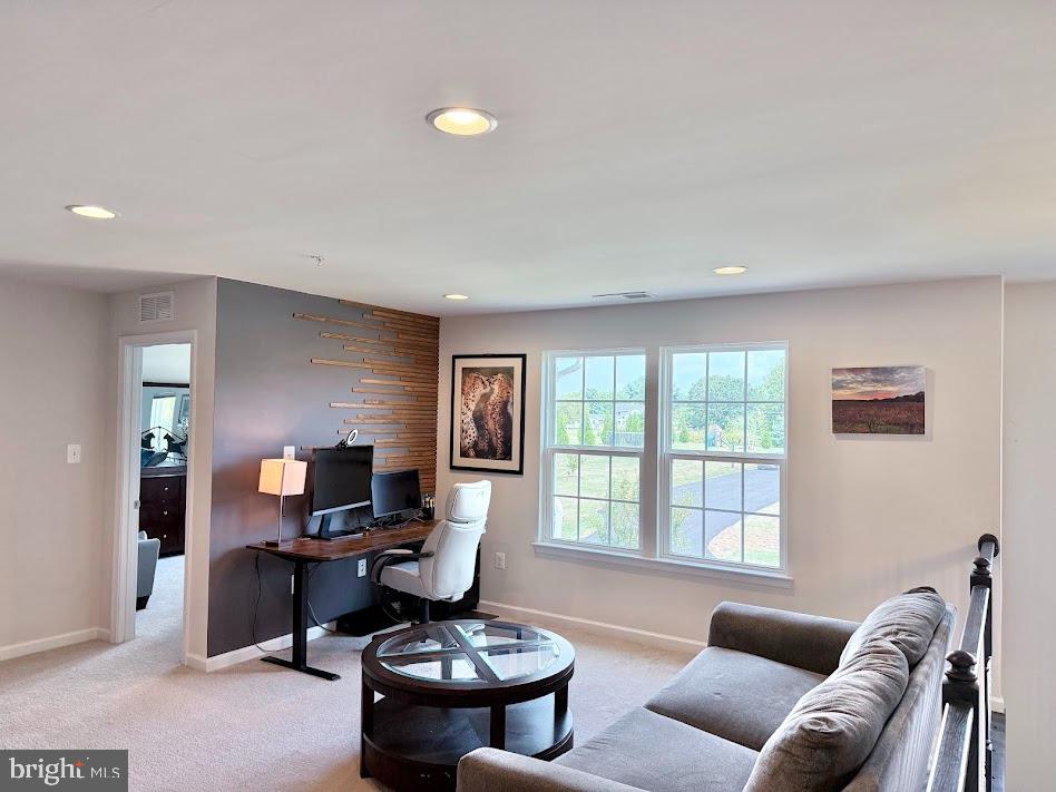 3012 Wasatch View Drive Frederick, MD 21704 - Photo 22 of 54 a living room with furniture a flat screen tv and a window
